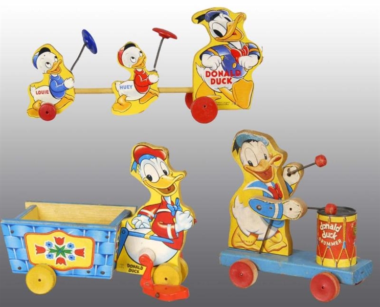 LOT OF 3: FISHER PRICE DONALD DUCK PULL TOYS.     