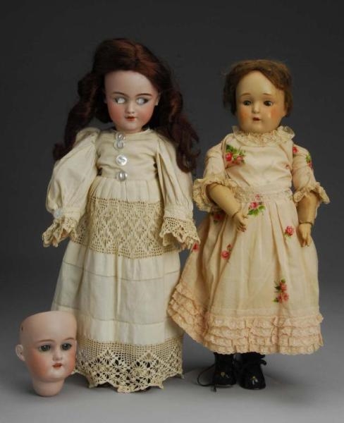 LOT OF 2: DOLLS AND ONE HEAD.                     