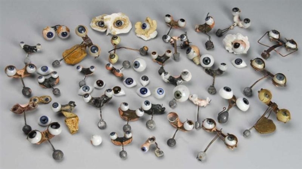  LARGE LOT OF VINTAGE AND ANTIQUE DOLL EYES.      