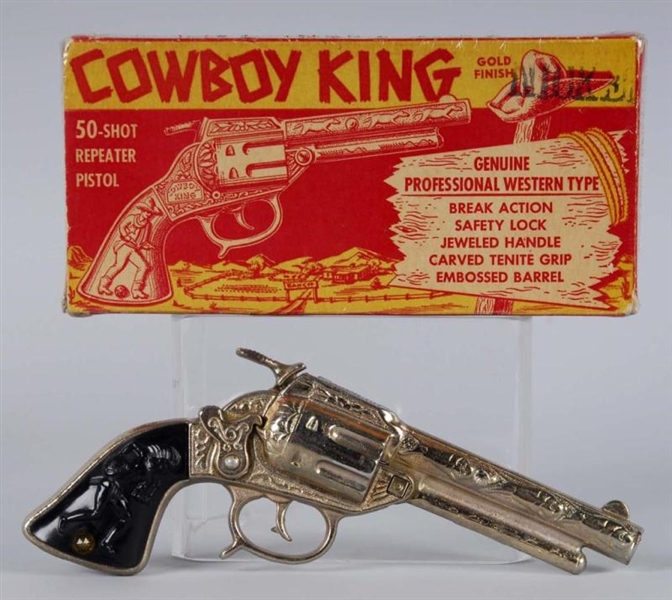 CAST IRON COWBOY KING GOLD CAP GUN.               