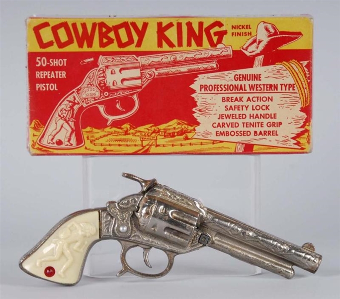 CAST IRON COWBOY KING CAP GUN.                    