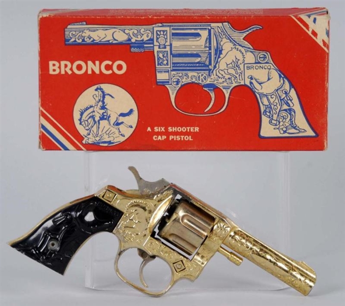 GOLD BRONCO CAP GUN.                              