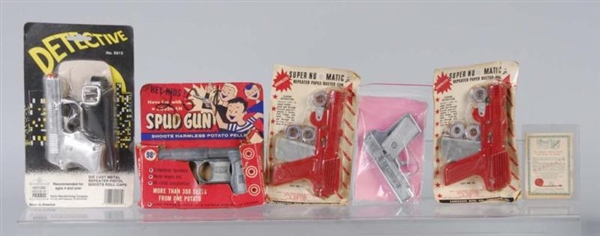 LOT OF 5: CAP GUNS ON CARDS.                      