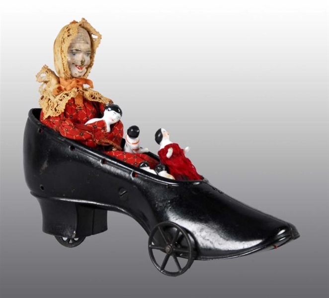 CAST IRON IVES OLD WOMAN IN THE SHOE PULL TOY.    