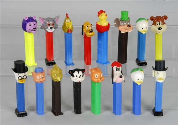 LOT OF 16: ASSORTED PEZ DISPENSERS.               
