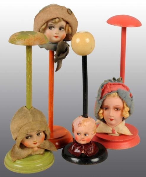 LOT OF 4: HAT STANDS.                             