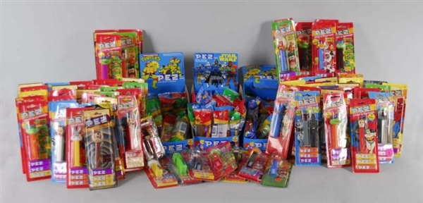 LARGE LOT OF ASSORTED PEZ DISPENSERS.             