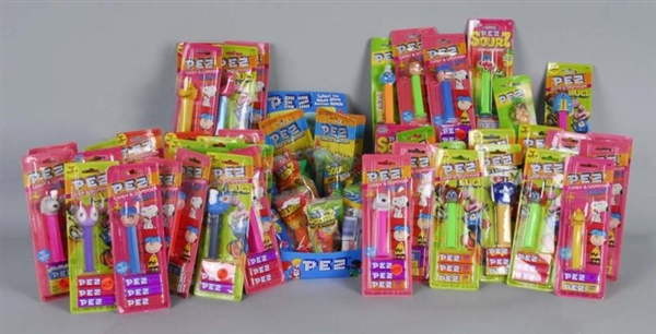 LARGE LOT OF PACKAGED PEZ DISPENSERS.             