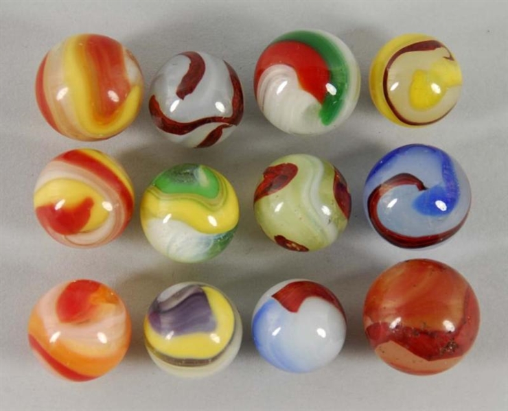 LOT OF 12: AKRO AGATE MARBLES.                    