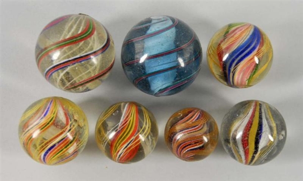 LOT OF 7: SWIRL MARBLES.                          