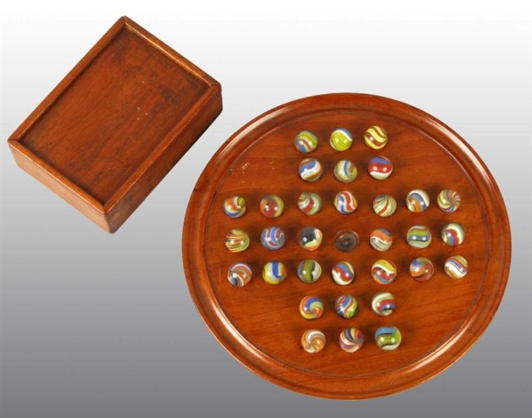 SOLITAIRE BOARD OF MARBLES.                       