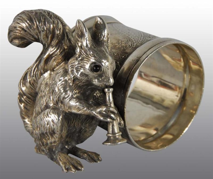 SQUIRREL PLAYING HORN FIGURAL NAPKIN RING.        