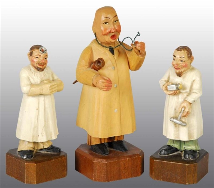 LOT OF 3: CARVED WOODEN FIGURES OF PHYSICIANS.    