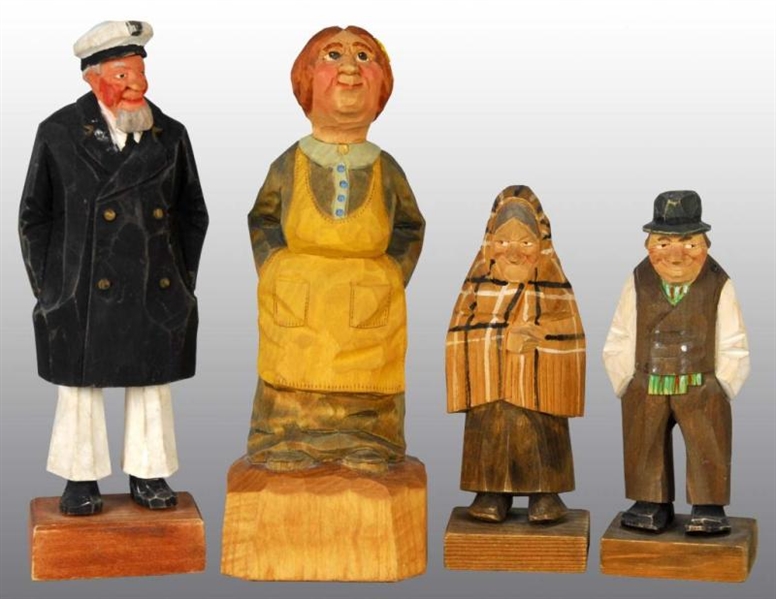 LOT OF 4: CARVED WOODEN FIGURES.                  