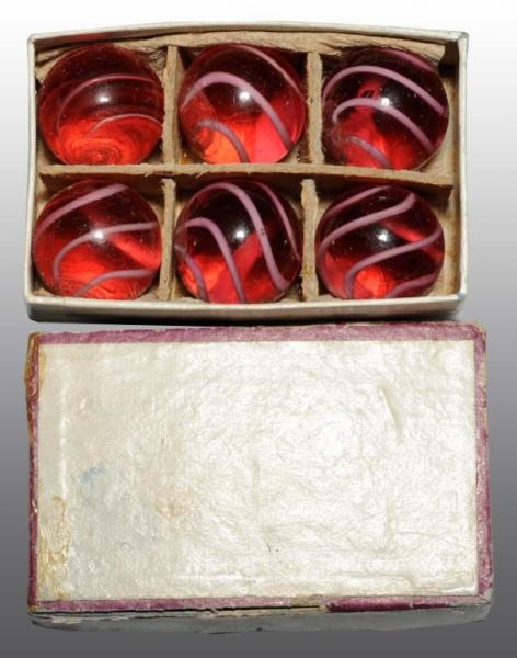 LOT OF 6: CRANBERRY SWIRL MARBLES IN BOX.         
