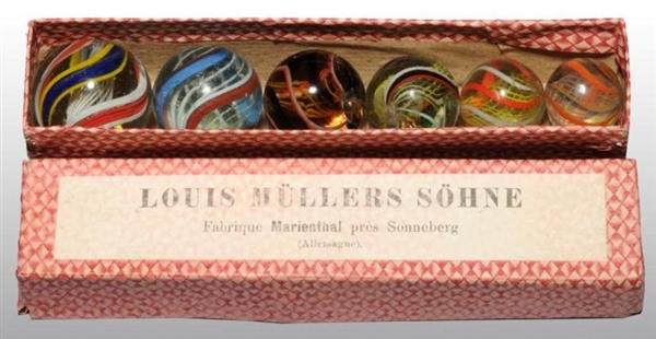 GRADUATED COFFIN BOX WITH 6 GERMAN SWIRL MARBLES. 