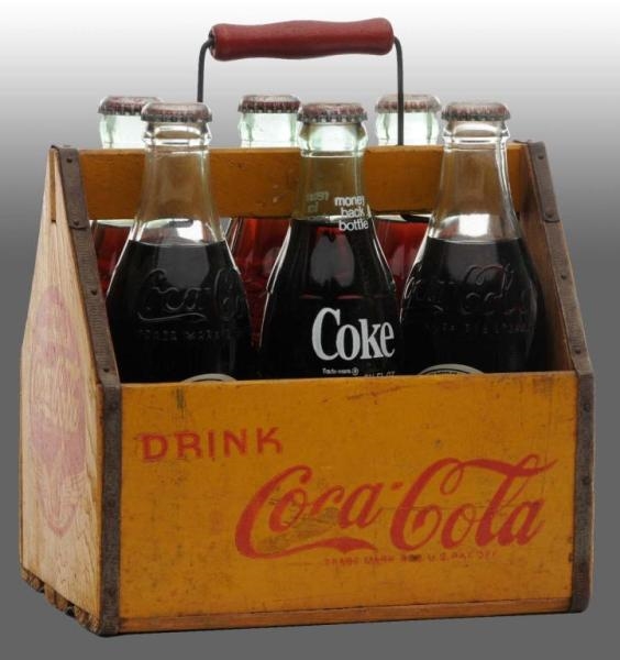 WOODEN COCA-COLA 6-PACK CARRIER WITH BOTTLES.     