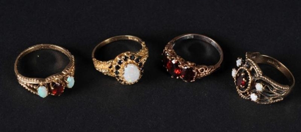 LOT OF 4: GOLD RINGS.                             