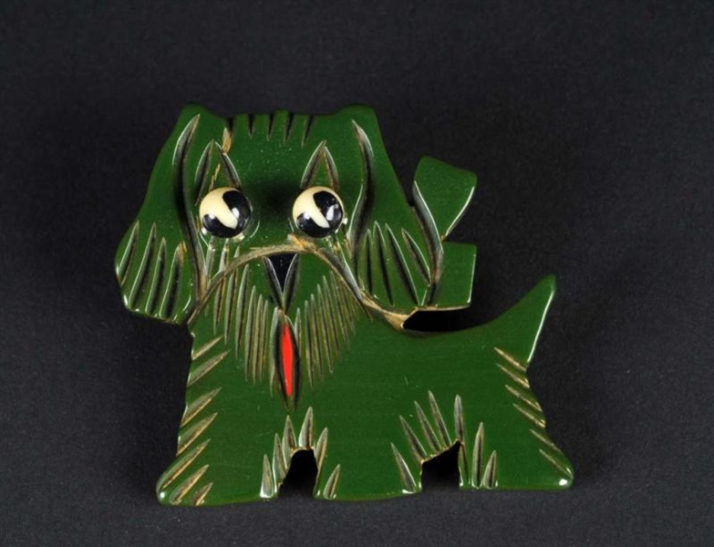 BAKELITE GREEN DOG PIN.                           