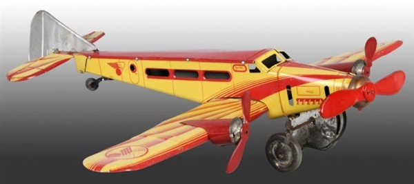 TIN AIRPLANE WIND-UP TOY.                         