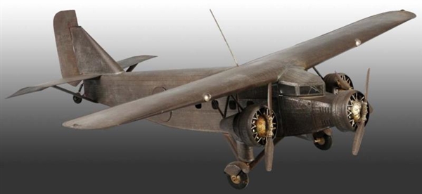 TIN SCRATCH-BUILT AIRPLANE TOY.                   