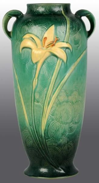 HANDLED ROSEVILLE VASE WITH LILY PATTERN.         
