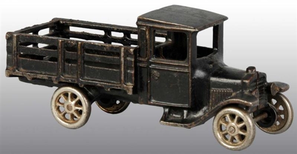 CAST IRON ARCADE MODEL T STAKE TRUCK TOY.         