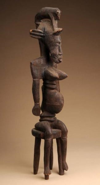 WEST AFRICAN SENUFO SEATED FIGURE.                