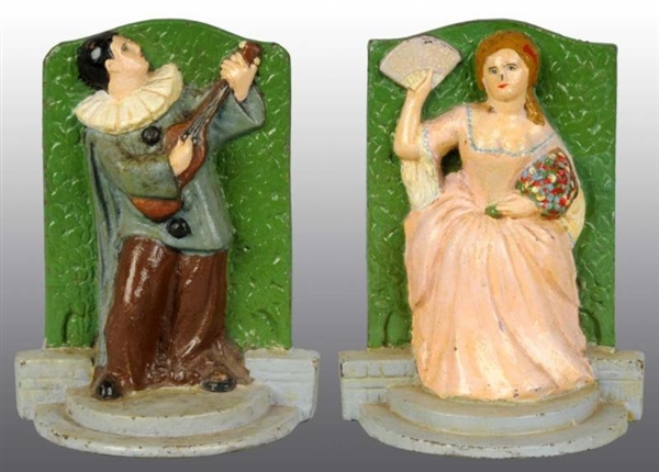 CAST IRON MAN WITH GUITAR/LADY WITH FAN BOOKENDS. 