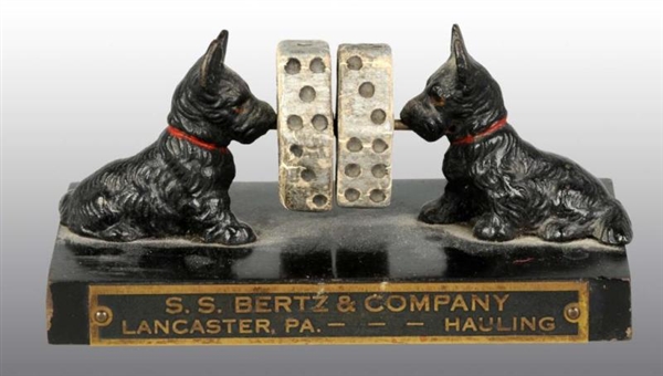 CAST IRON SCOTTIE WITH DICE PAPERWEIGHT.          
