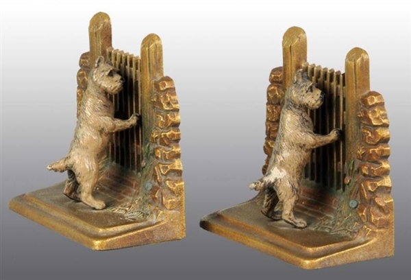 CAST IRON SCOTTIES LEANING ON GATE BOOKENDS.      
