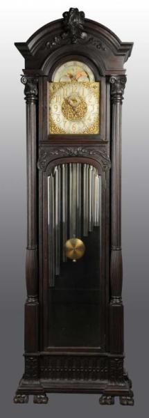 OAK TALL CASE CLOCK WITH MOON DIAL.               
