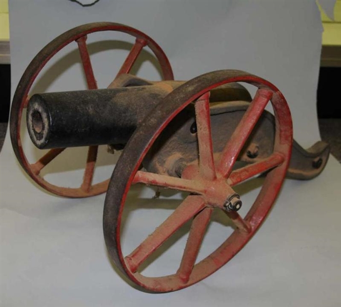 CANNON WITH RED PAINTED WHEELS.                   