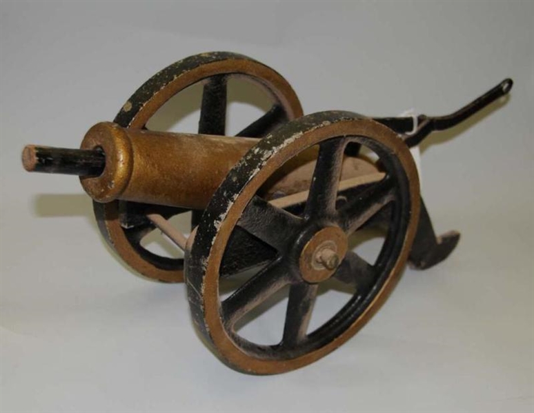 BRASS BREECHES BUOY CANNON WITH CAST IRON WHEELS. 