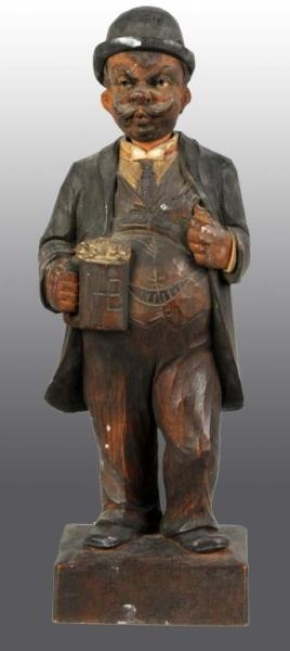 WOODEN HAND CARVED WHISTLER FIGURE.               