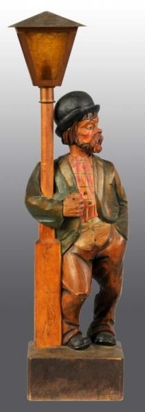WOODEN HAND CARVED WHISTLER FIGURE.               
