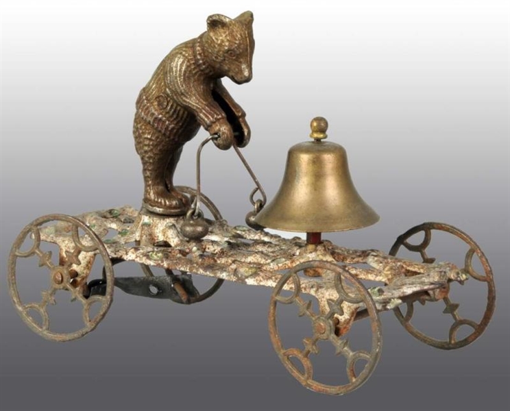 CAST IRON BEAR RINGING BELL BELL TOY.             