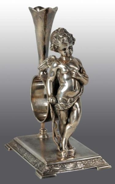 STANDING CUPID WITH BOW NAPKIN HOLDER.            