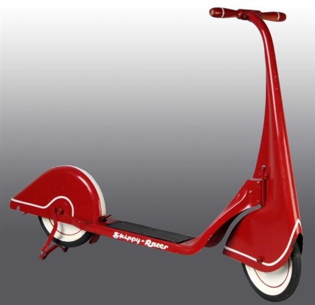PRESSED STEEL SKIPPY RACER SCOOTER TOY.           