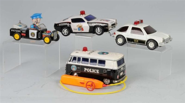 LOT OF 4: TIN & PRESSED STEEL POLICE CAR TOYS.    