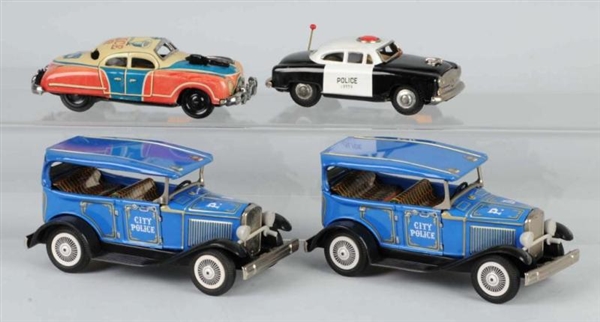 LOT OF 4: TIN POLICE CAR FRICTION TOYS.           