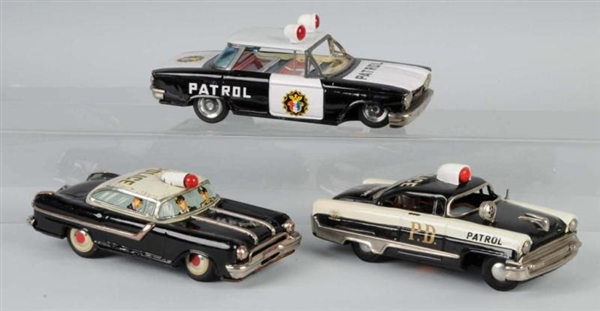 LOT OF 3: TIN POLICE CAR FRICTION TOYS.           