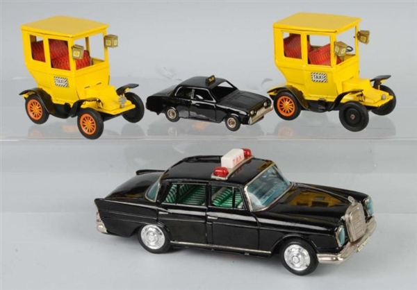 LOT OF 4: TIN FRICTION & BATTERY-OP TAXI TOYS.    