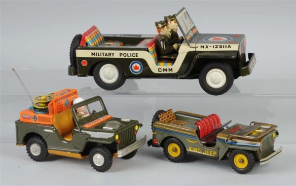 LOT OF 3: TIN MILITARY JEEP FRICTION TOYS.        