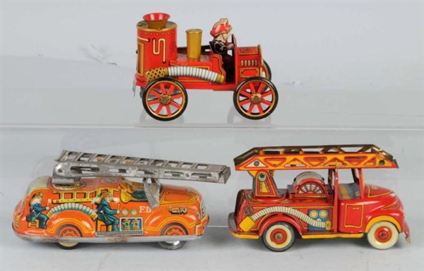 LOT OF 3: TIN FIRE TRUCK FRICTION TOYS.           