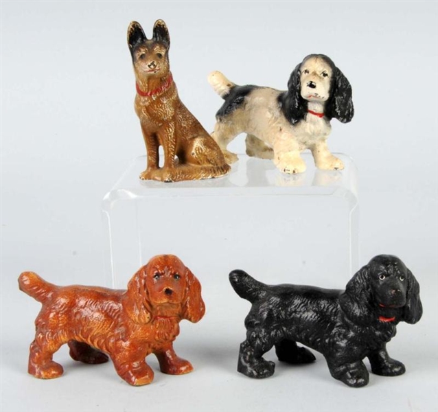 LOT OF 4: CAST IRON DOG PAPERWEIGHTS.             
