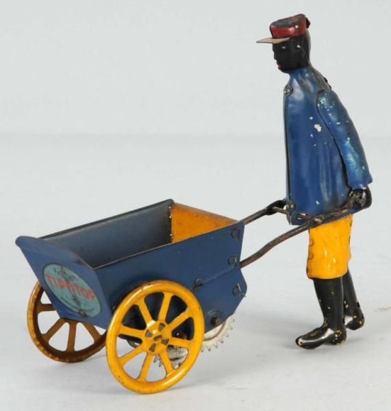 TIN STRAUSS PORTER WITH CART WIND-UP TOY.         