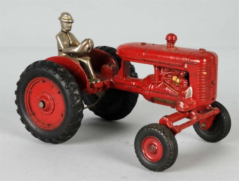 CAST IRON TRACTOR TOY.                            