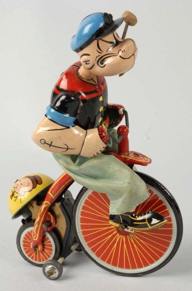 TIN LITHO LINEMAR POPEYE ON BICYCLE WIND-UP TOY.  