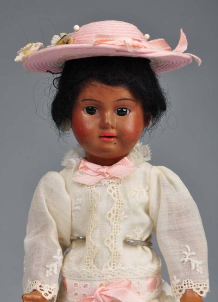 BROWN FRENCH BISQUE CHILD DOLL.                   